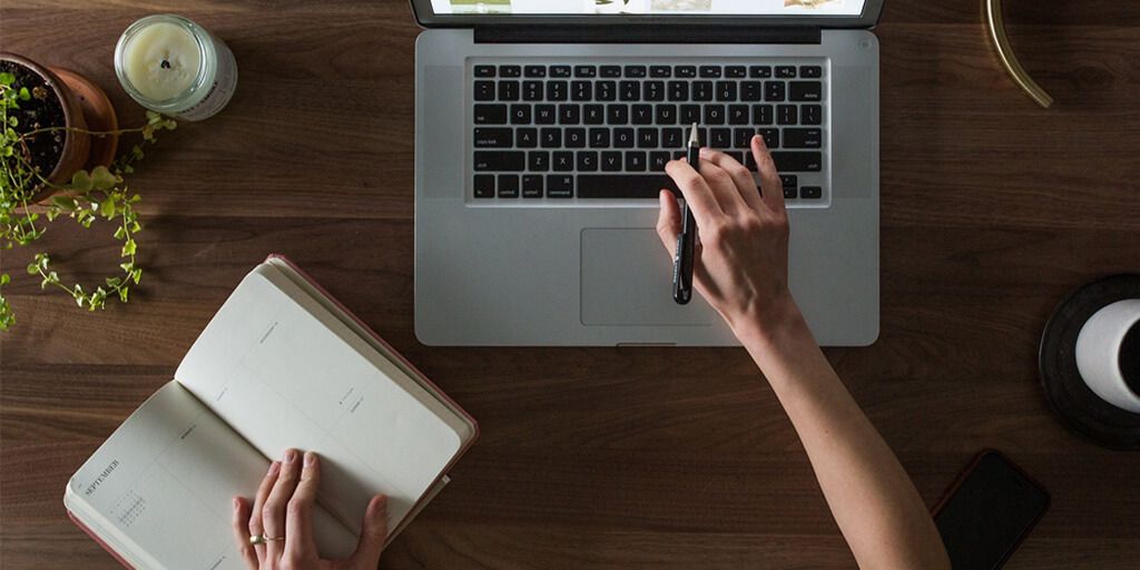 person typing on laptop