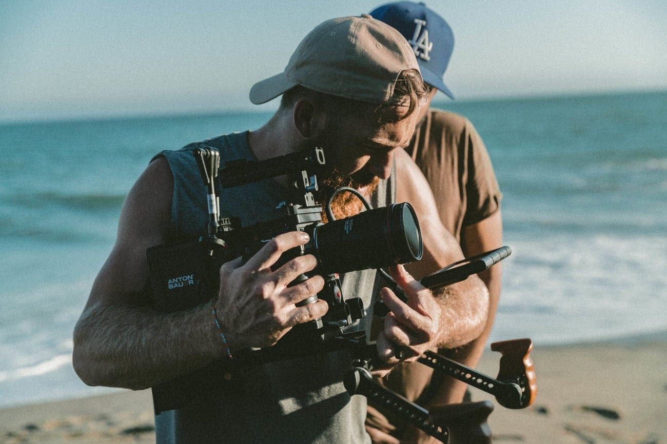 man on the beach with camera